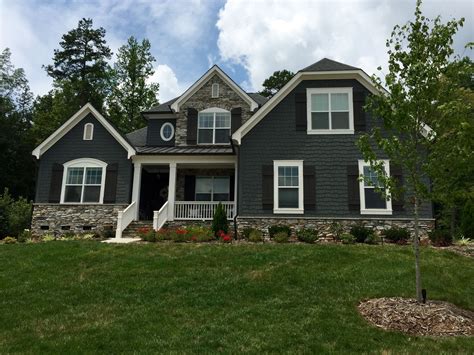 grey house white metal roof|grey houses with black shutters.